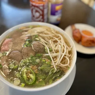 a bowl of soup with meat and vegetables