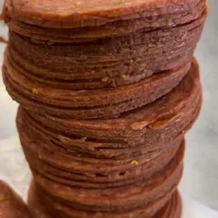 Small batch old world pepperoni being sliced for our pepperoni rolls- available at the Saturday Farmers Markets