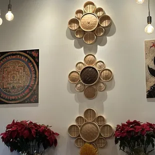 baskets on the wall and flowers in vases