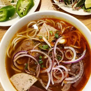 a bowl of soup and a plate of salad