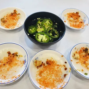 Told this was a must order, it was good as a starter. Rice cake with a savory sweet sauce to pour onto with a pork crackling.