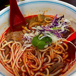 Half eaten small bowl bun bo hue (I added the extra spicy sate)