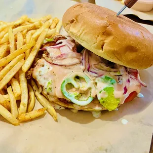Guac Bun - chicken, avocado, tomato, grilled onions, jalapeno sauce, fries, drink