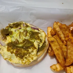 Bun kabab ( lentil patty, egg and chutney) with fries