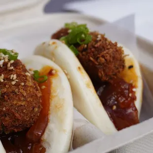 two buns in a styrofoam container