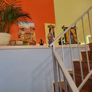 a staircase with a potted plant