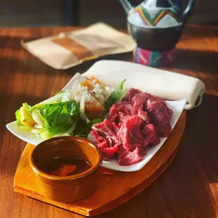 Qoort, butcher fresh filet cuts served raw with spices and salad. Tartare challenge