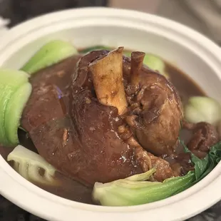 a bowl of beef and bok choy