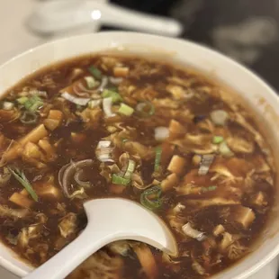 a bowl of soup with a spoon
