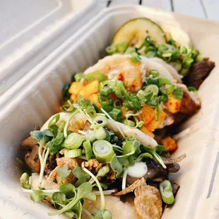 a close up of a sandwich in a styrofoam container
