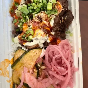 Korean bbq beef rice bowl with the recommended 2 sauce's !  It was so good  for my first Bun'd Up meal!!