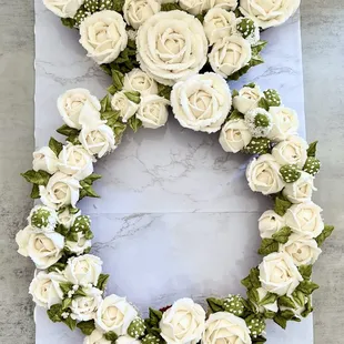 a wreath of white roses
