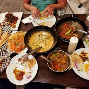 The feast! Loves their goat leg wok dish and creamy karahi chicken. Pass on the potato and okra.