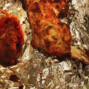  two pieces of chicken on tin foil