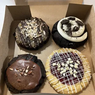 Top left: German chocolate  Top right: cookies and cream Bottom left: Texas sheet cake  Bottom right: white chocolate lemon raspberry