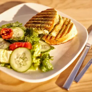 Treat yourself to our mouthwatering Roasted Turkey Panini!  With toasted Italian bread filled with roasted turkey, brie cheese, and a deli