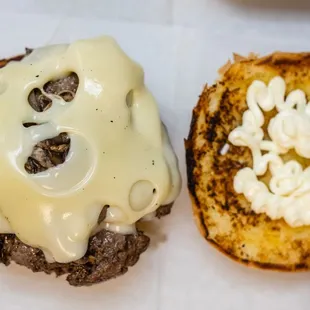 a hamburger with cheese on it