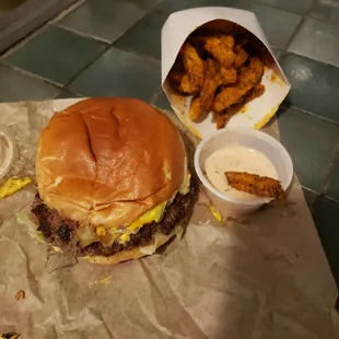 Bacon bacon burger with season fries and sauce.