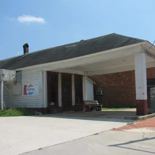 a white building with a black roof