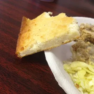 The Cornbread is thin, chewy, and without a lot of taste.