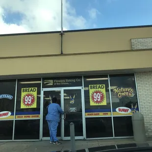 a woman standing in front of a store