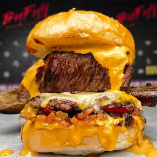 To Rib and Die IN LA.Bone-in short rib, onion marmalade, Calabrian Chili Mayo, Melted Hickory Cheddar, and Bacon on top
of a Japanese Wagyu