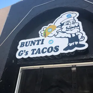 a sign for bunti g&apos;s tacos