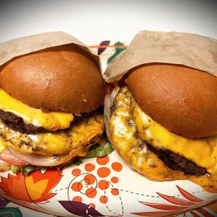 two cheeseburgers on a plate