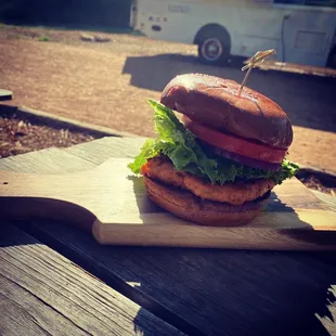a burger on a cutting board