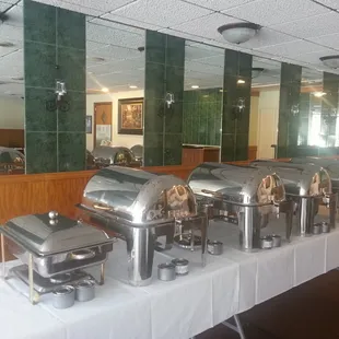 a buffet table with a variety of food items