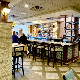 people sitting at the bar