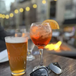 a drink and sunglasses on a table