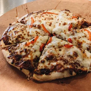 a pizza on a cutting board