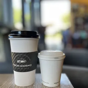 two coffee cups on a table