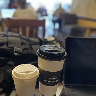 a laptop and a cup of coffee