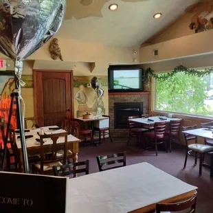 a dining room with tables and chairs
