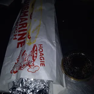 a hot dog wrapped in foil