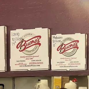 a row of pizza boxes