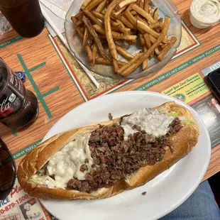 Cheesesteak sub and fries.