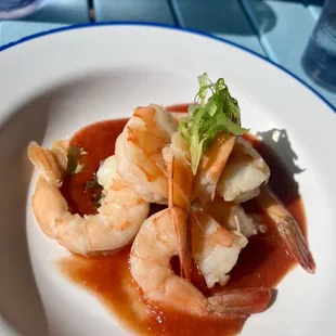 Chilled Shrimp Cocktail with cocktail sauce.