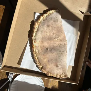 "Beast" calzone. For reference that is an XL pizza box.
