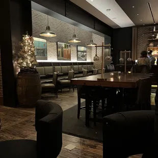 a dining area with tables and chairs