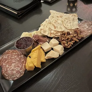 a platter of meat and cheese