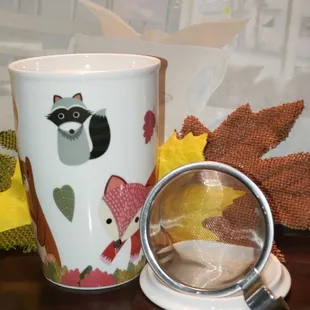 a coffee cup with a raccoon on it