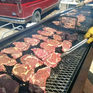 meat being cooked on a grill