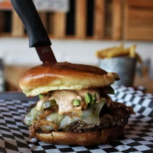 The Southwest Burgar: Pepper-jack cheese, grilled poblano peppers, pickled jalapeños, crispy onions, avocado, and creamy chipotle sauce.