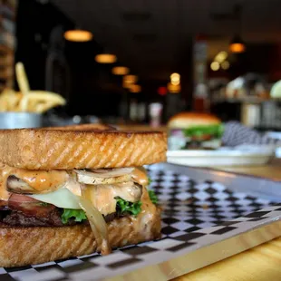 a grilled sandwich on a checkered tray