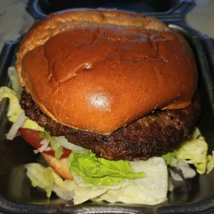 Impossible vegan plant based Impossible,patty, onions, lettuce, Roma tomato, toasted whole wheat bun. Sweet potato fries and Coke/sugarless.