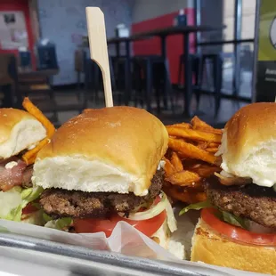 a tray of hamburgers and fries