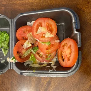 Look how many tomatoes was place on a single cheesy burger